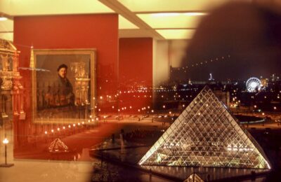 Paris - Photo taken from a window of Louvre museum interior one part reflects painting from inside and the other part from outside with pyramid